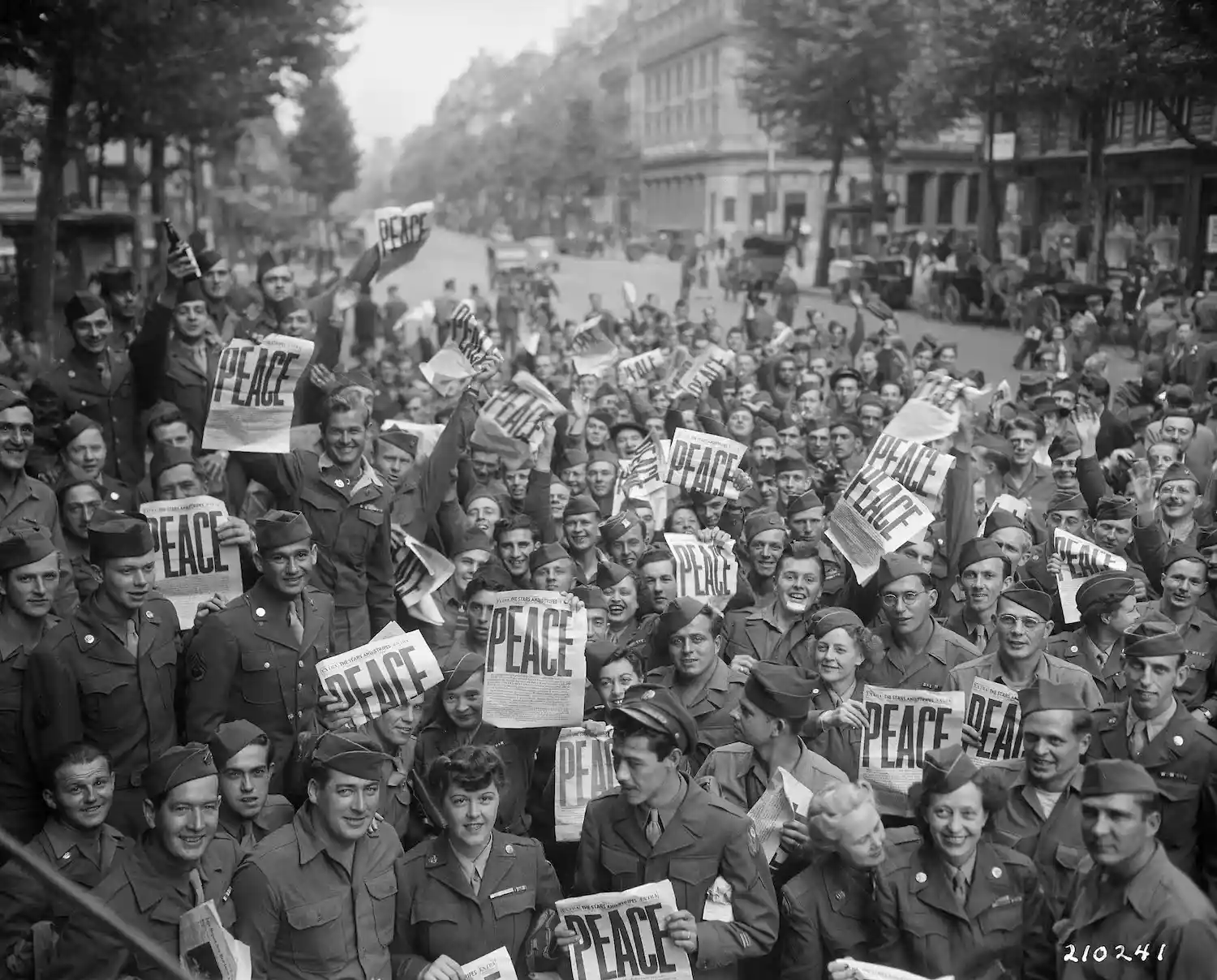 American military personnel gather in Paris to celebrate victory over Japan.